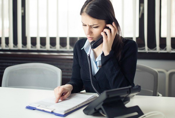 confused woman on phone